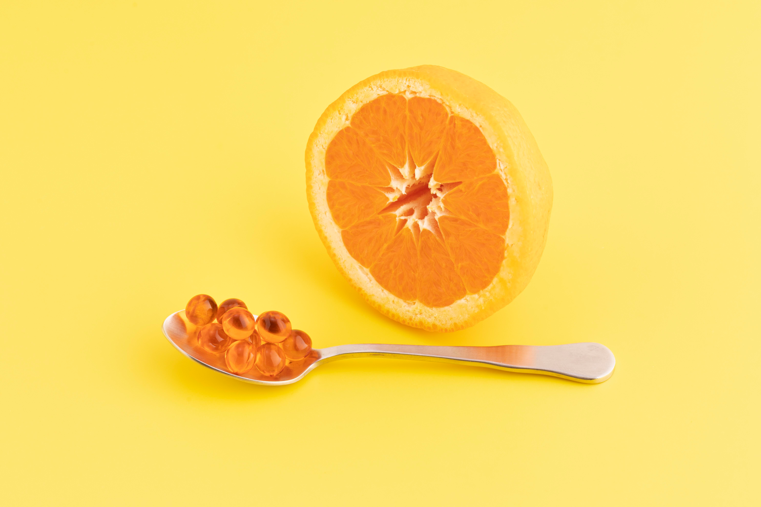 Suplemen vs Makanan Sehat blogs - close-up-food-complements-with-orange